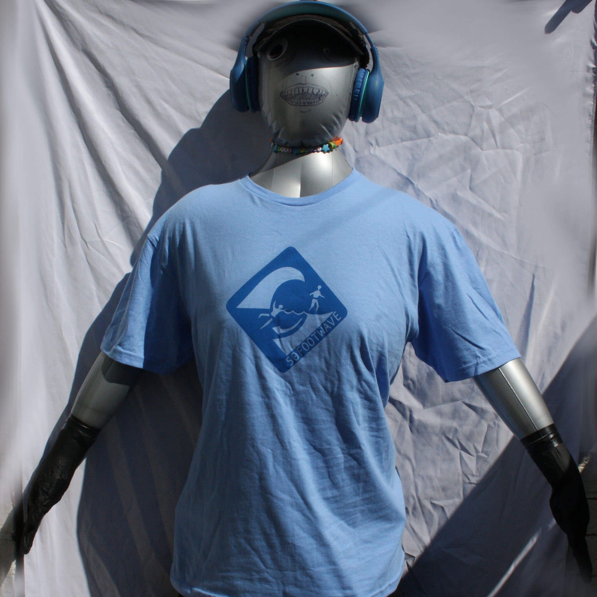 50 Foot Wave logo t-shirt, hand screen-printed in vibrant blue on a Carolina Blue, 100% cotton Gildan Softstyle fabric, designed by ElRatDesigns