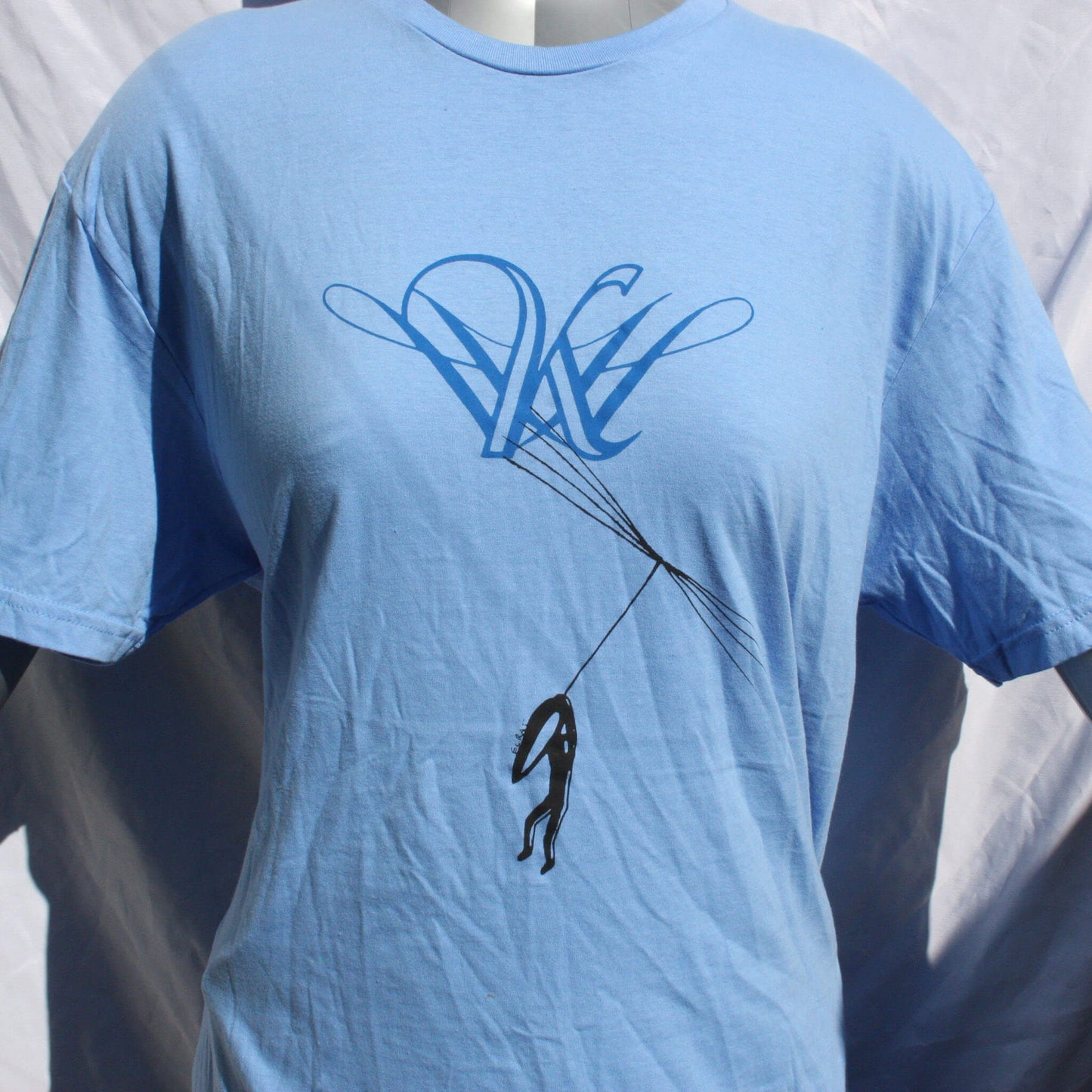 Dandelion Hope t-shirt with Kristin Hersh inspired design, screen printed on a comfortable cotton tee carolina blue close