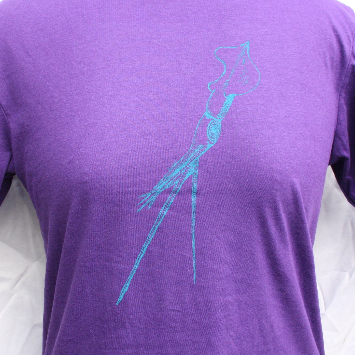 Purple T-shirt featuring a hand-drawn whiplash squid design, with intricate tentacle details and artistic lines.