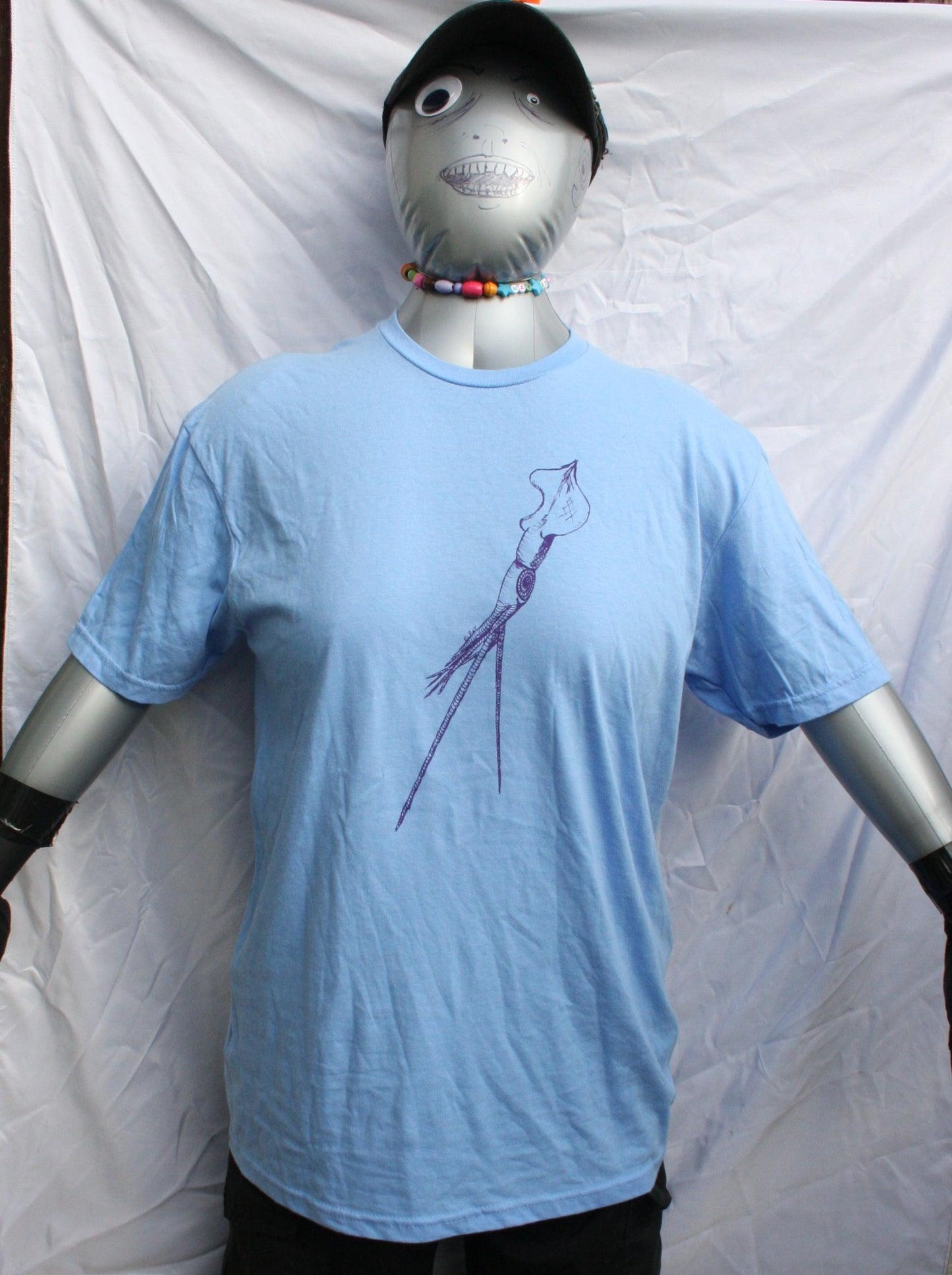 Caroline blue T-shirt featuring a hand-drawn whiplash squid design, with intricate tentacle details and artistic lines.