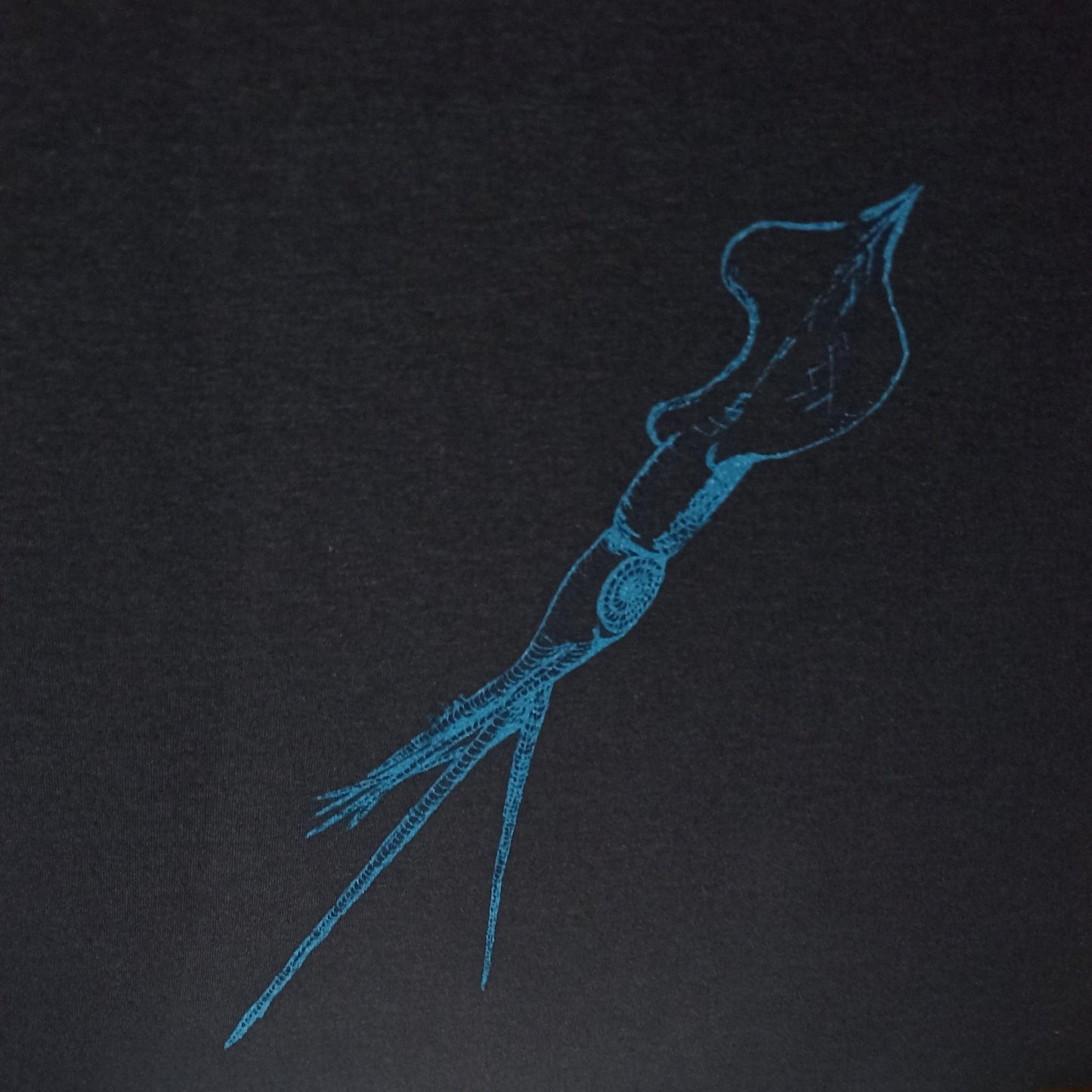 Black T-shirt featuring a hand-drawn whiplash squid design, with intricate tentacle details and artistic lines.