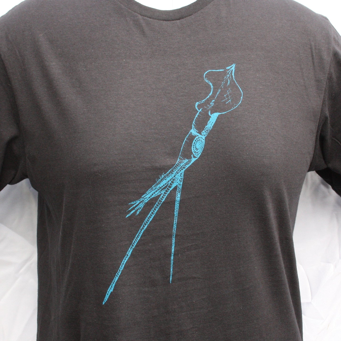 Black T-shirt featuring a hand-drawn whiplash squid design, with intricate tentacle details and artistic lines.