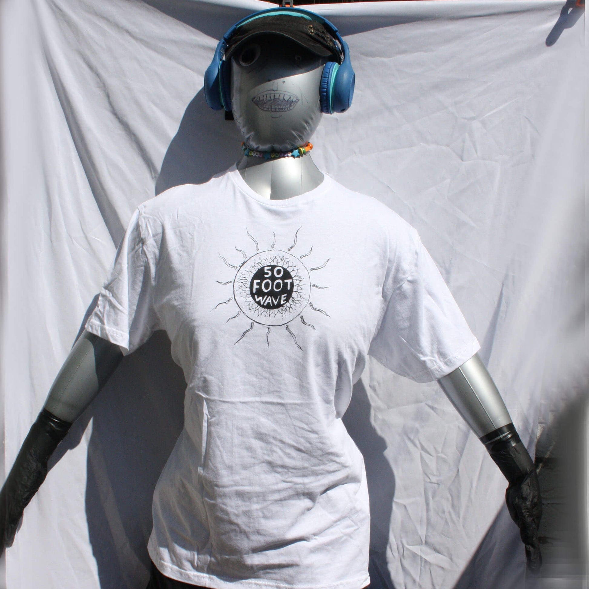 50 Foot Wave 'Staring into the Sun' hand-printed tee by ElRat Designs, showcasing vibrant band shirt on high-quality cotton fabric. Unique design with eco-friendly ink.