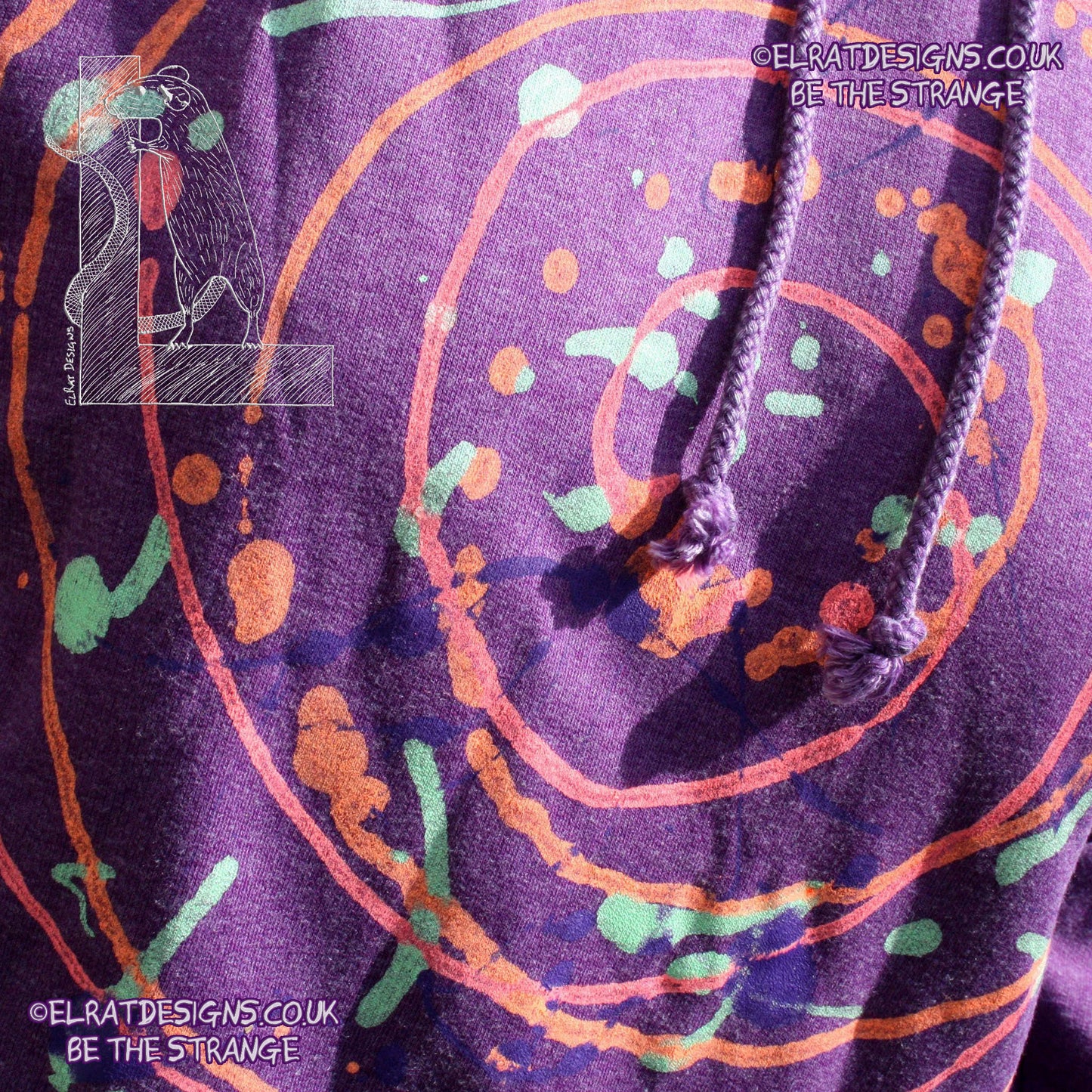 Purple hoodie with a one of a kind Splatter Print spiral SP-MP-Hd-P-S1 using some UV ink, part of a mirrored pair "MC-Splatter001" by ElRat Designs - elratdesigns.co.uk