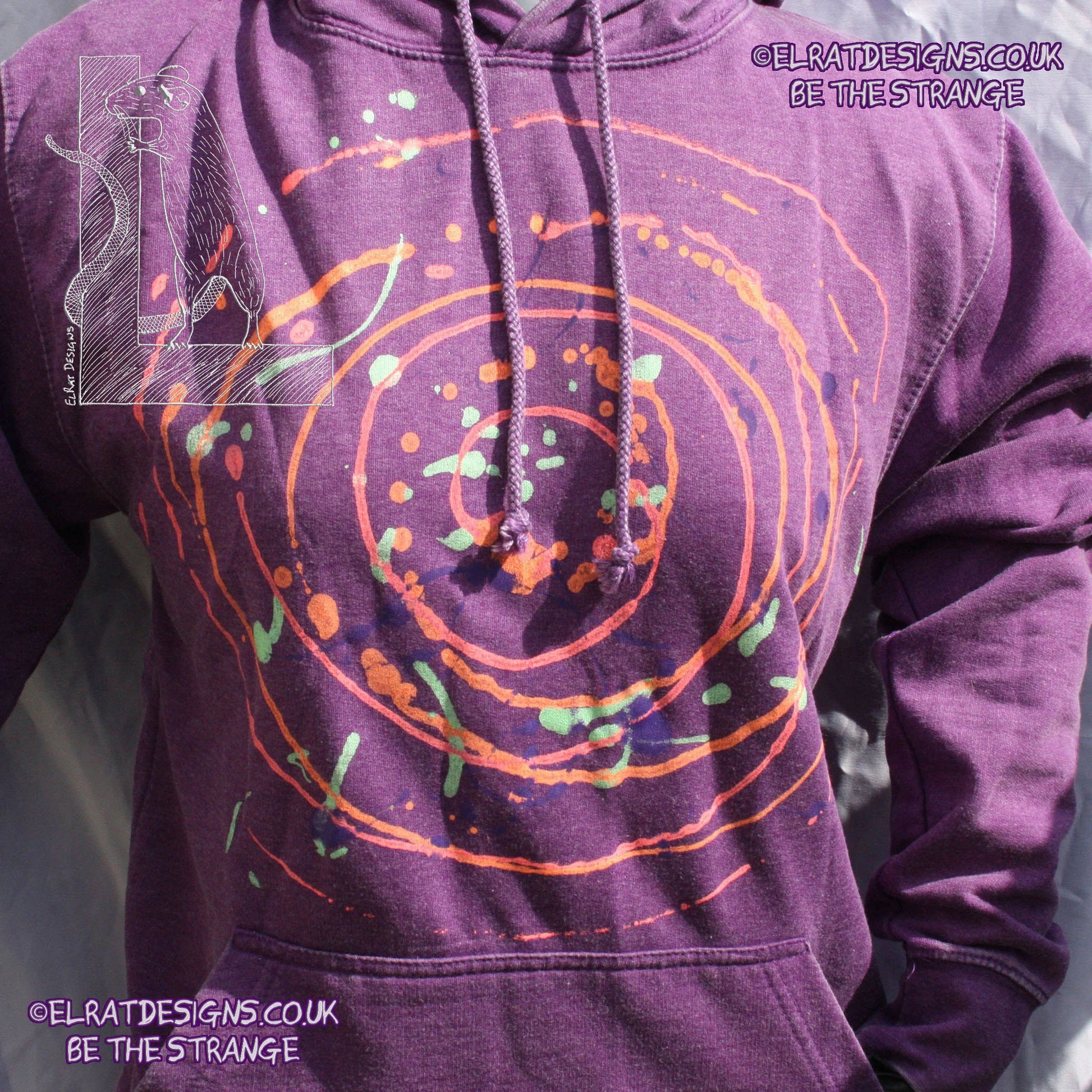 Purple hoodie with a one of a kind Splatter Print spiral SP-MP-Hd-P-S1 using some UV ink, part of a mirrored pair "MC-Splatter001" by ElRat Designs - elratdesigns.co.uk