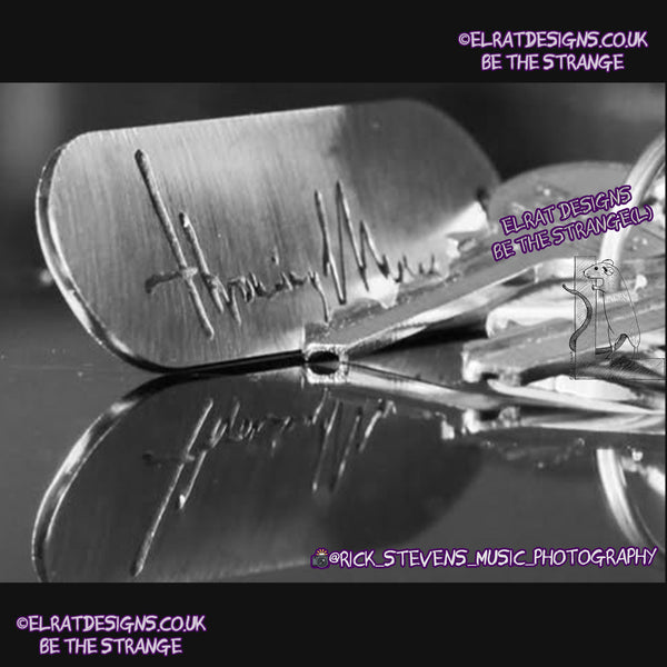 Throwing Muses 1986 logo CNC laser-cut stainless steel keyring, made in the UK from scrap for ElRat Designs - hero - Photo by @rick_stevens_music_photography on Instagram - elratdesigns.co.uk