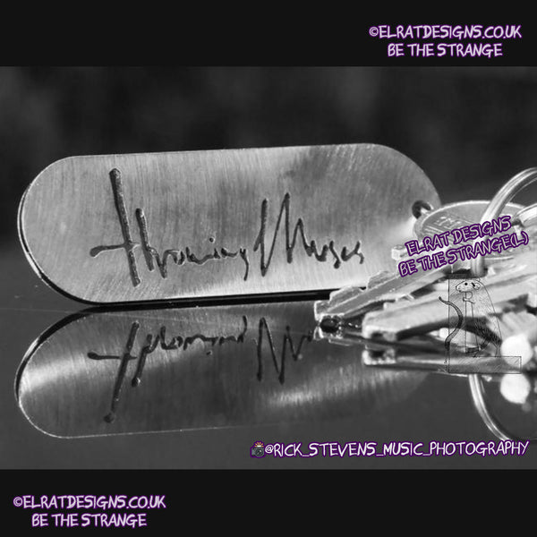 Throwing Muses 1986 logo CNC laser-cut stainless steel keyring, made in the UK from scrap for ElRat Designs - hero - Photo by @rick_stevens_music_photography on Instagram - elratdesigns.co.uk