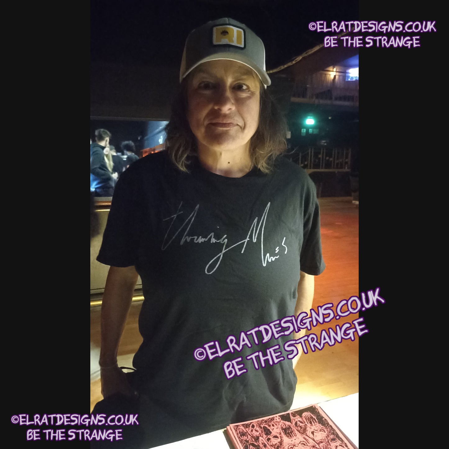 ElRat in the Wild.  Lazy Eye Handwritten custom T-Shirt, spotted in London on the UK Throwing Muses tour. Throwing Muses font 2024, on the front. Available exclusively from ElRat designs - hero - elratdesigns.co.uk