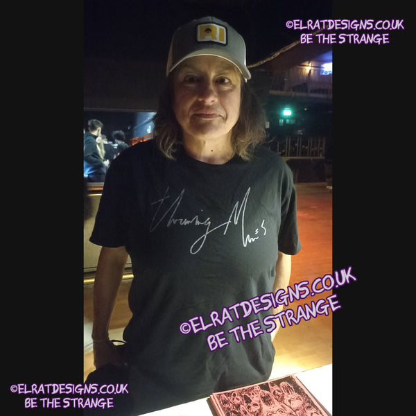 ElRat in the Wild.  Lazy Eye Handwritten custom T-Shirt, spotted in London on the UK Throwing Muses tour. Throwing Muses font 2024, on the front. Available exclusively from ElRat designs - hero - elratdesigns.co.uk