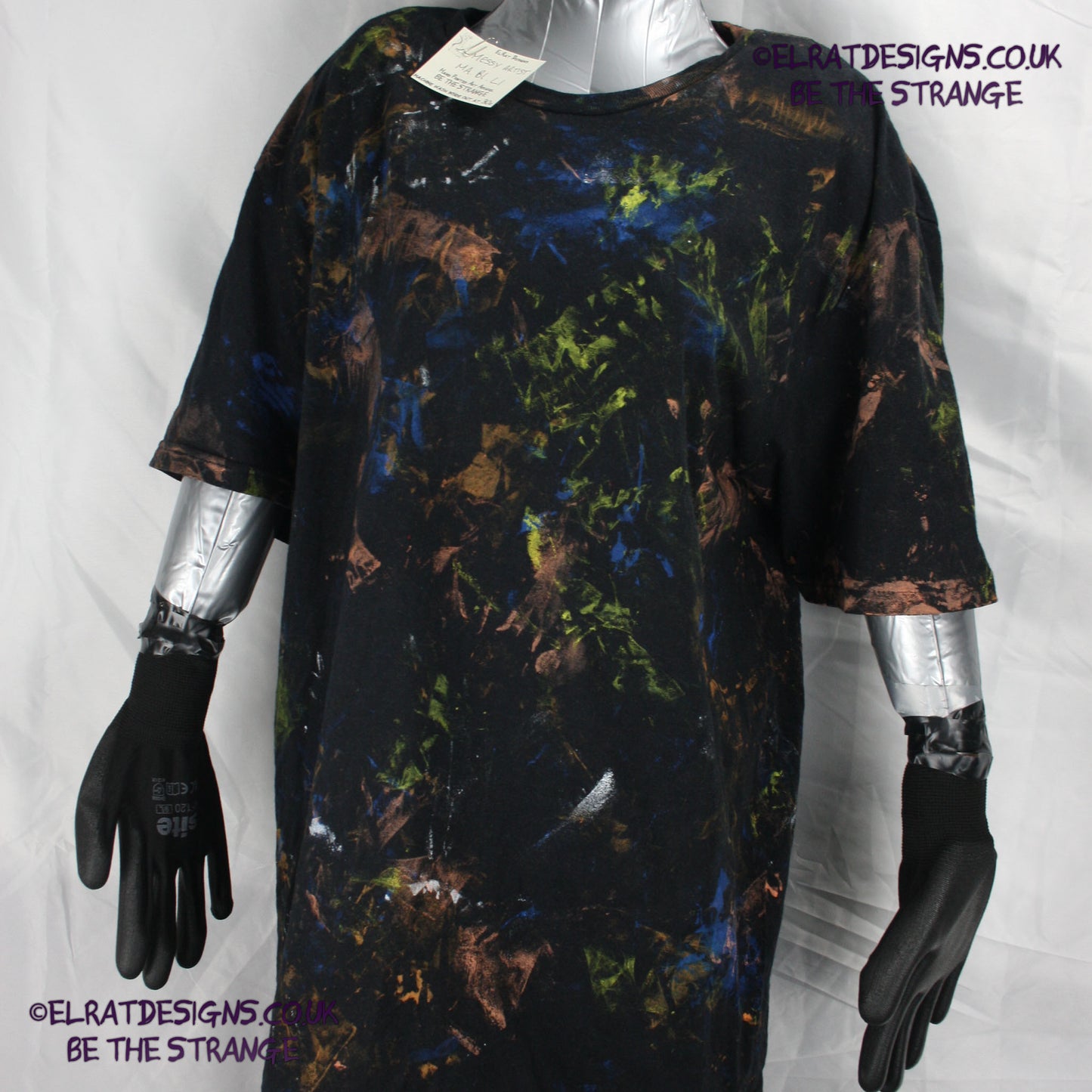 Messy Artist shirt from ElRat Designs - MA Bl L1 - One of a kind eco friendly art shirt. Made using waste ink. Black Shirt with Blue, Yellow and Fluorescent Orange, I think a bit of silver, likely some other colours. Please check the photos This is your shirt - hero - elratdesigns.co.uk