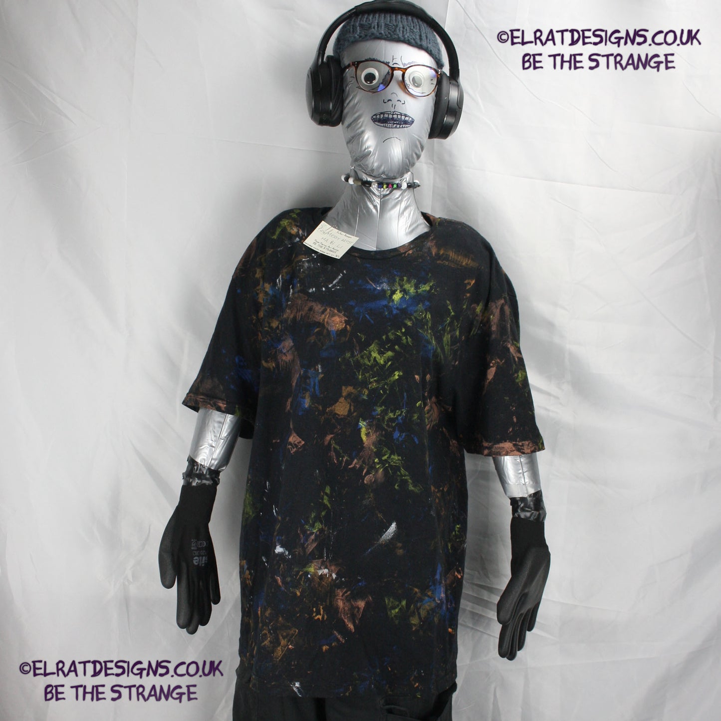 Messy Artist shirt from ElRat Designs - MA Bl L1 - One of a kind eco friendly art shirt. Made using waste ink. Black Shirt with Blue, Yellow and Fluorescent Orange, I think a bit of silver, likely some other colours. Please check the photos This is your shirt - hero - elratdesigns.co.uk