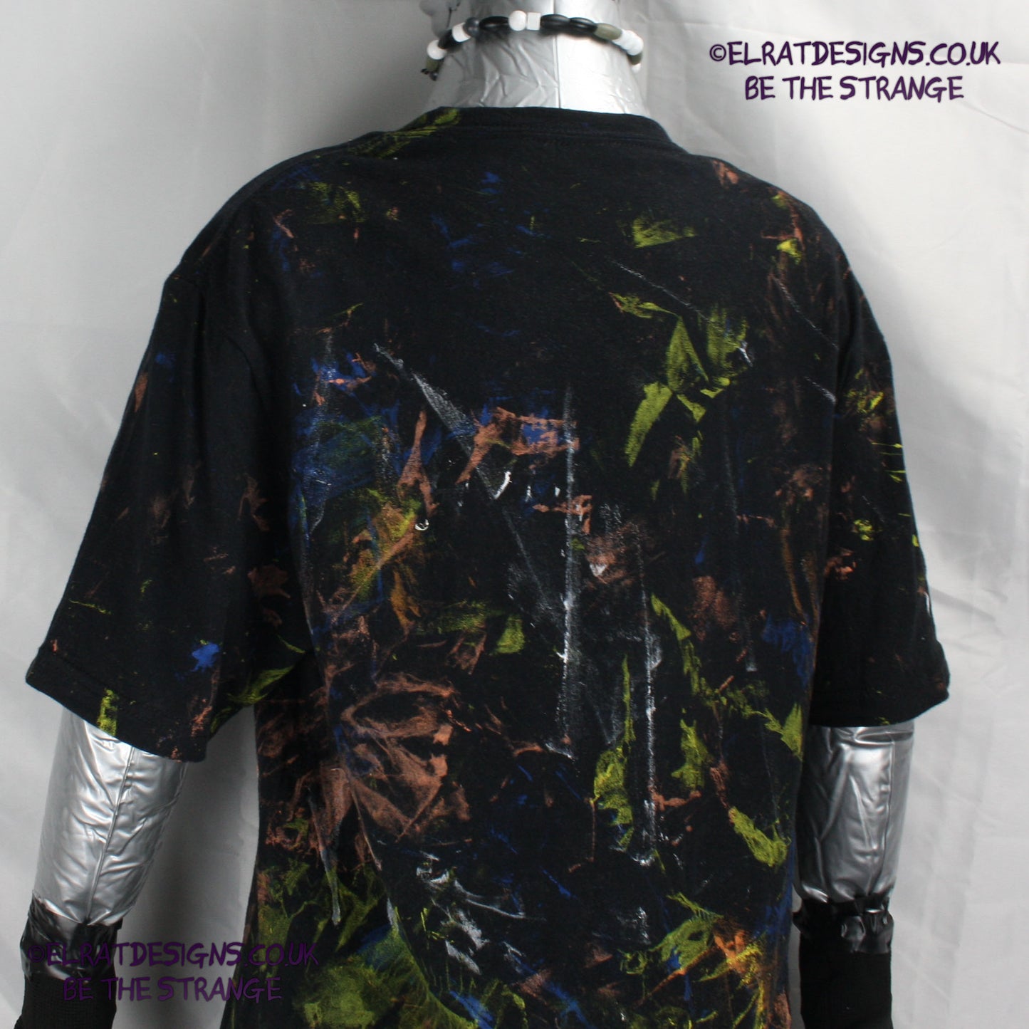 Messy Artist shirt from ElRat Designs - MA Bl S2 - One of a kind eco friendly art shirt. Made using waste ink. Black Shirt with Blue, Yellow and Fluorescent Orange, I think a bit of silver, likely some other colours. Please check the photos This is your shirt - hero - elratdesigns.co.uk