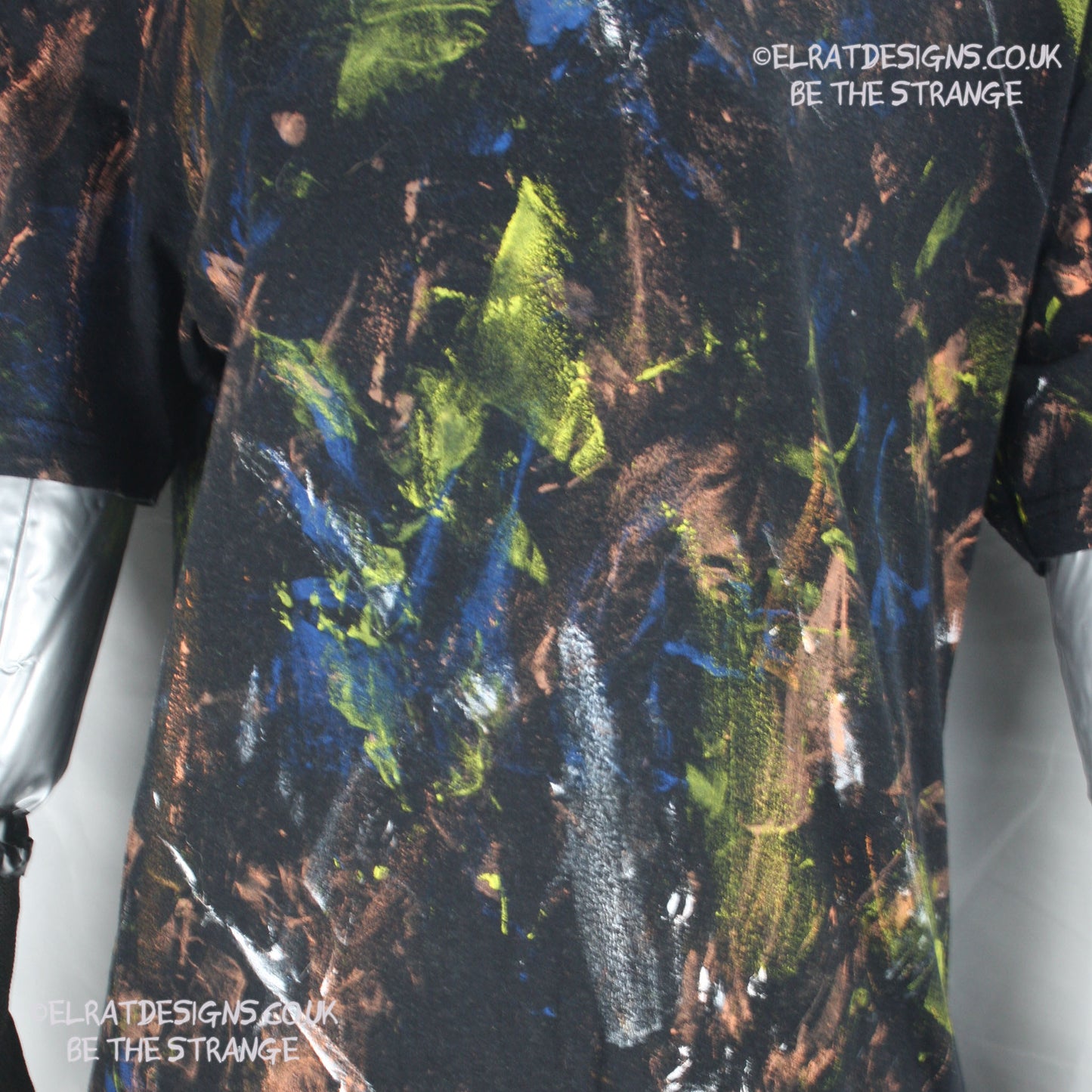 Messy Artist shirt from ElRat Designs - MA Bl S2 - One of a kind eco friendly art shirt. Made using waste ink. Black Shirt with Blue, Yellow and Fluorescent Orange, I think a bit of silver, likely some other colours. Please check the photos This is your shirt - hero - elratdesigns.co.uk