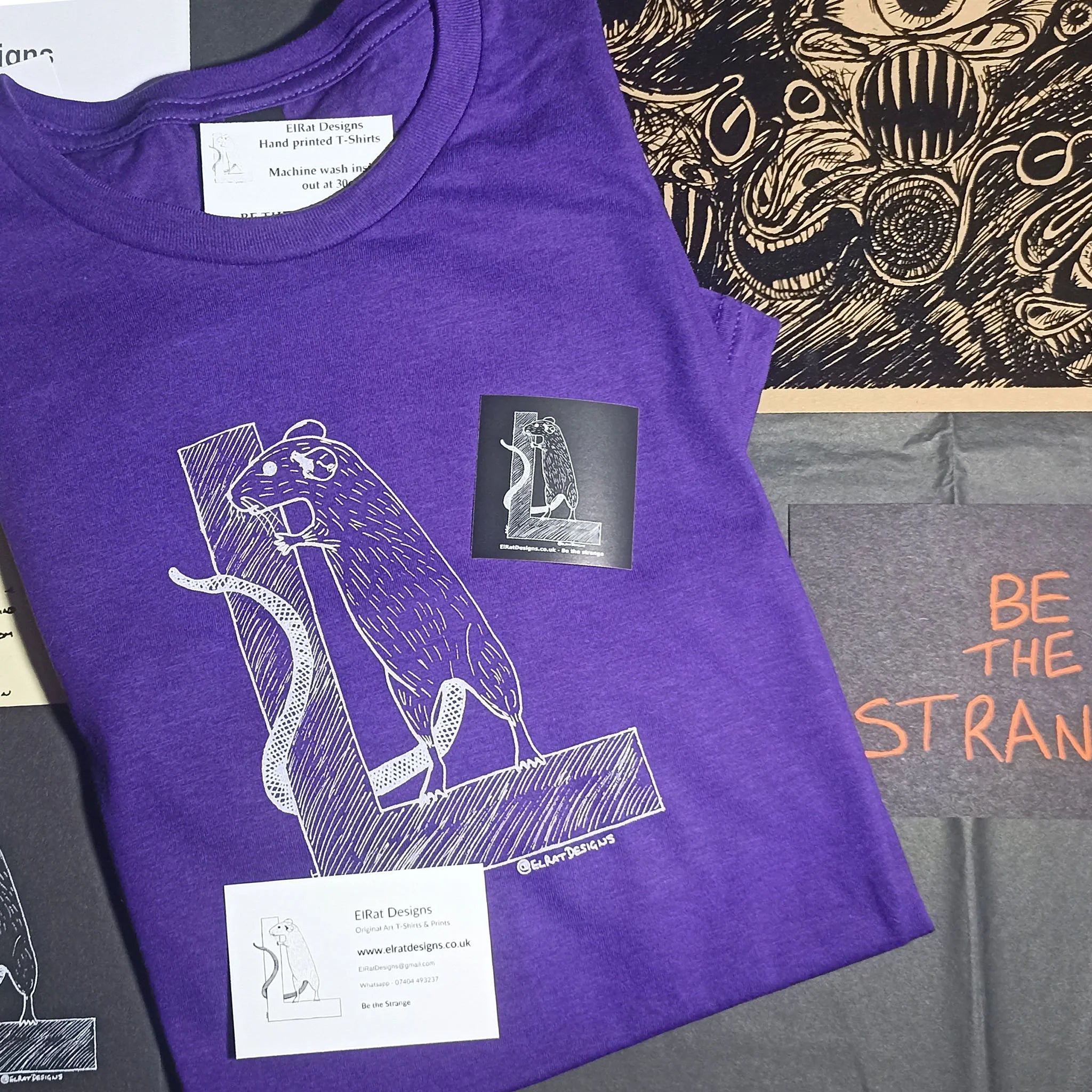 ElRat Designs logo Purple t-shirt with screeching eyeballs free test print