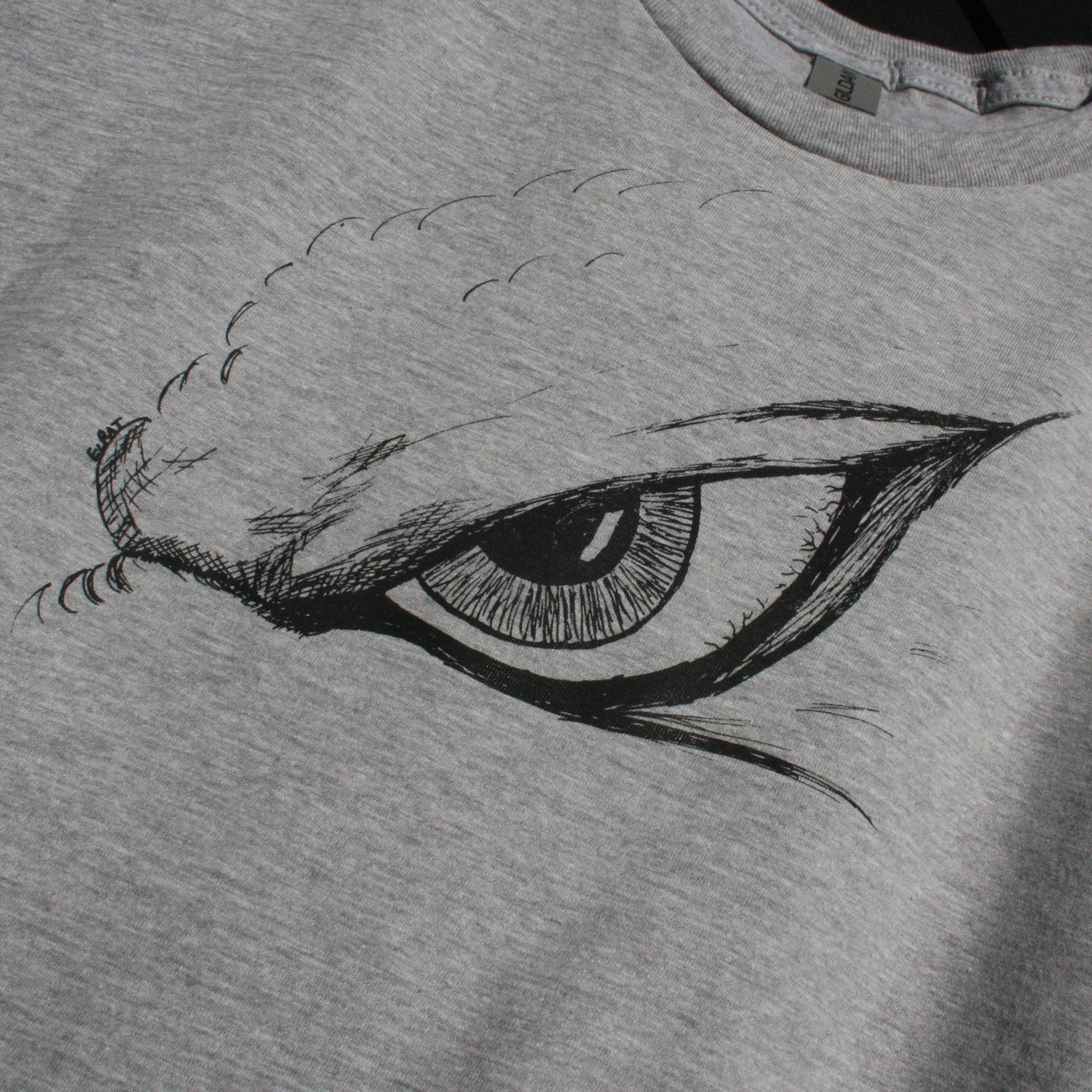 Hand-drawn Kaiju eye design on a screen-printed t-shirt, inspired by Japanese monster movies.