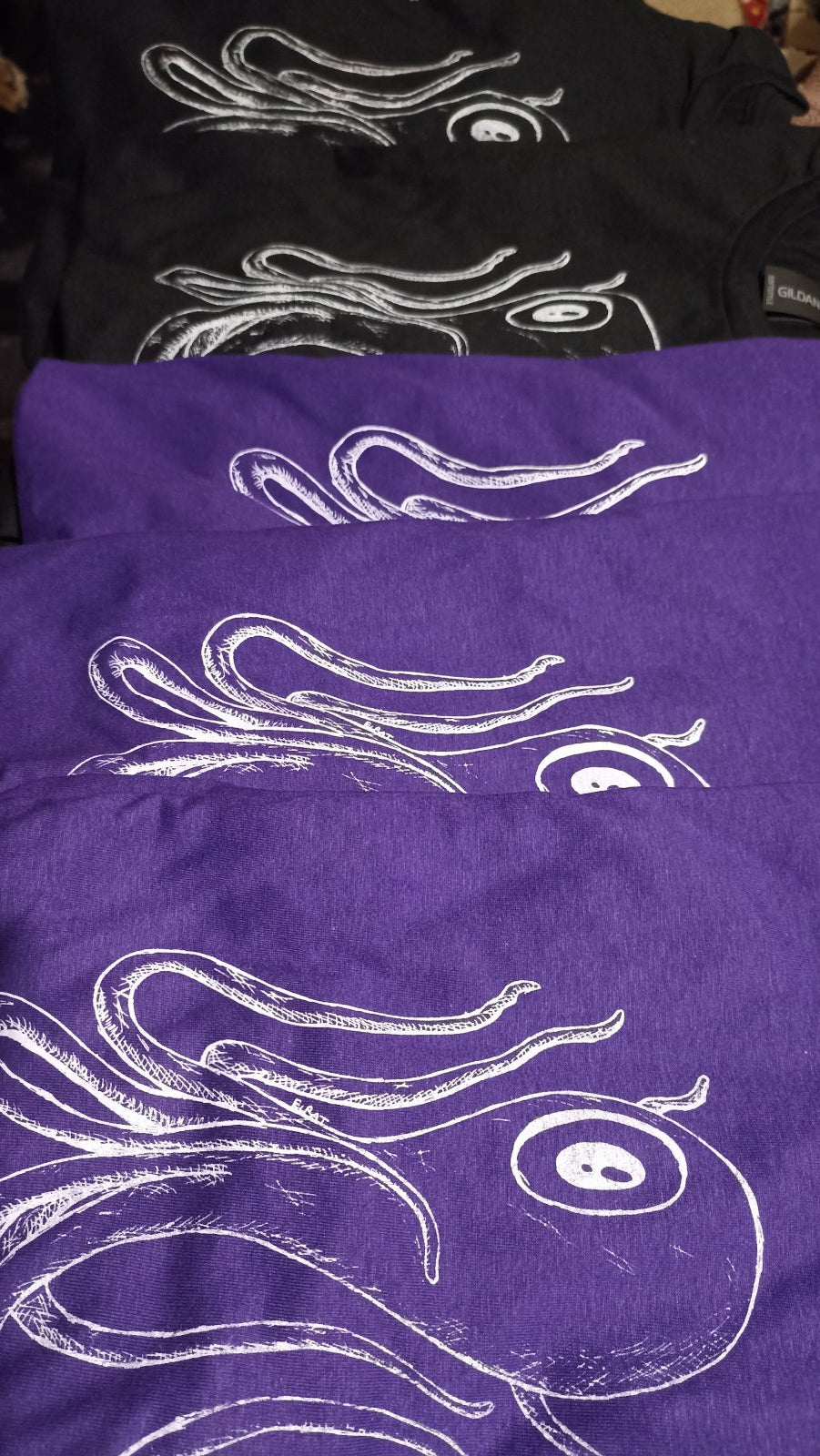 Octoclops Tees in  row, designed and printed by ELRat