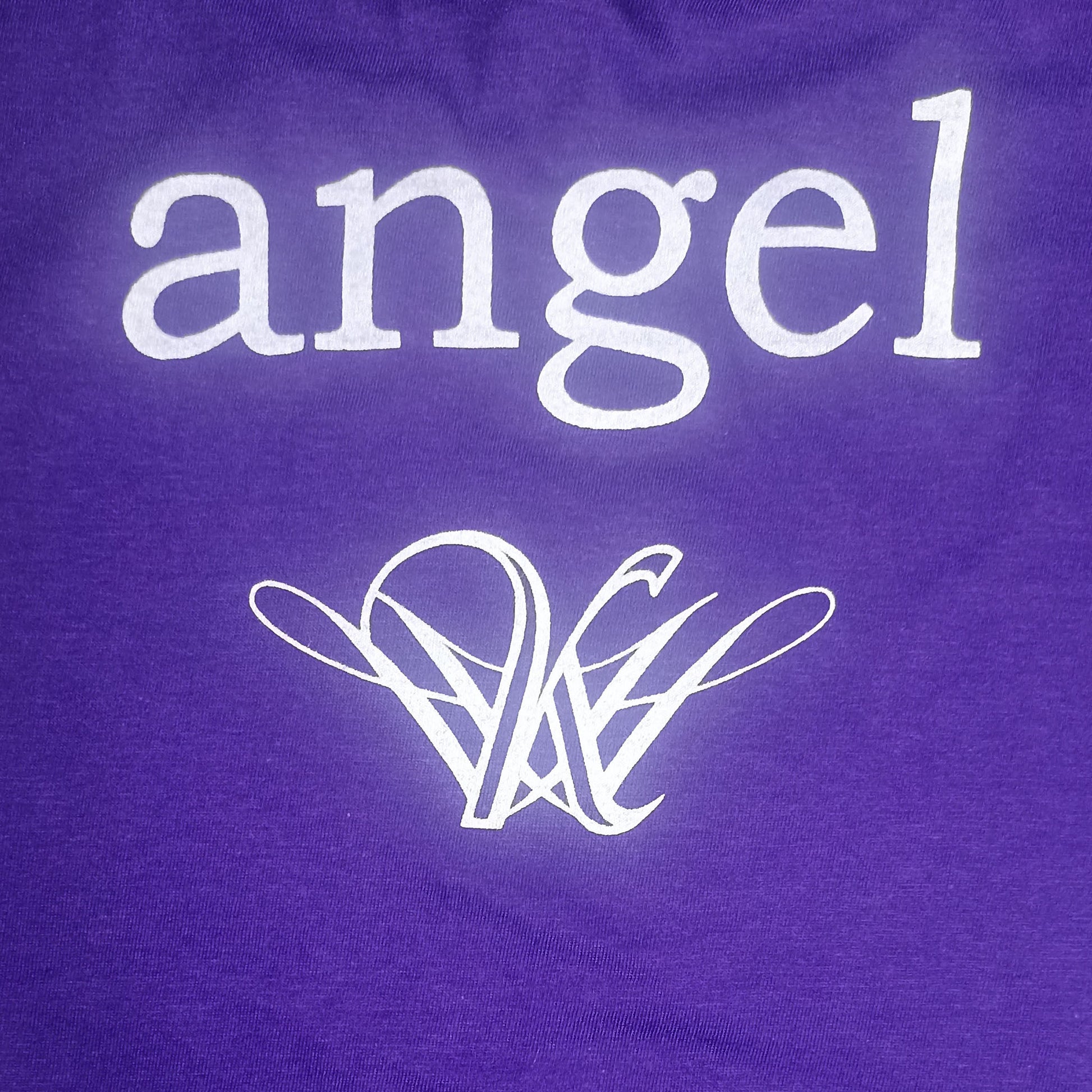 Strange angel exclusive Purple shirt with 'angel' text and logo on a purple background