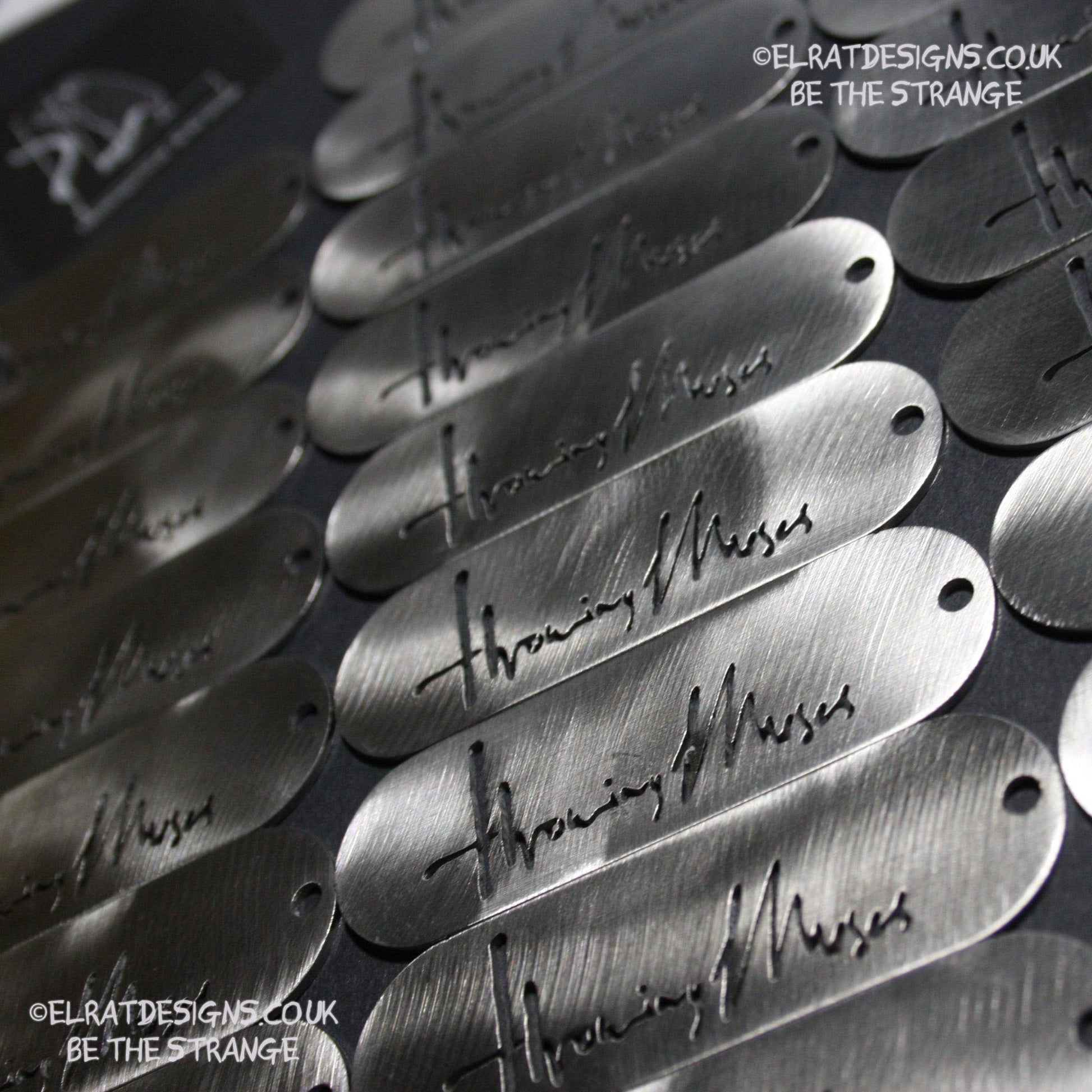 Throwing Muses 1986 logo CNC laser-cut stainless steel keyring, made in the UK from scrap for ElRat Designs - elratdesigns.co.uk