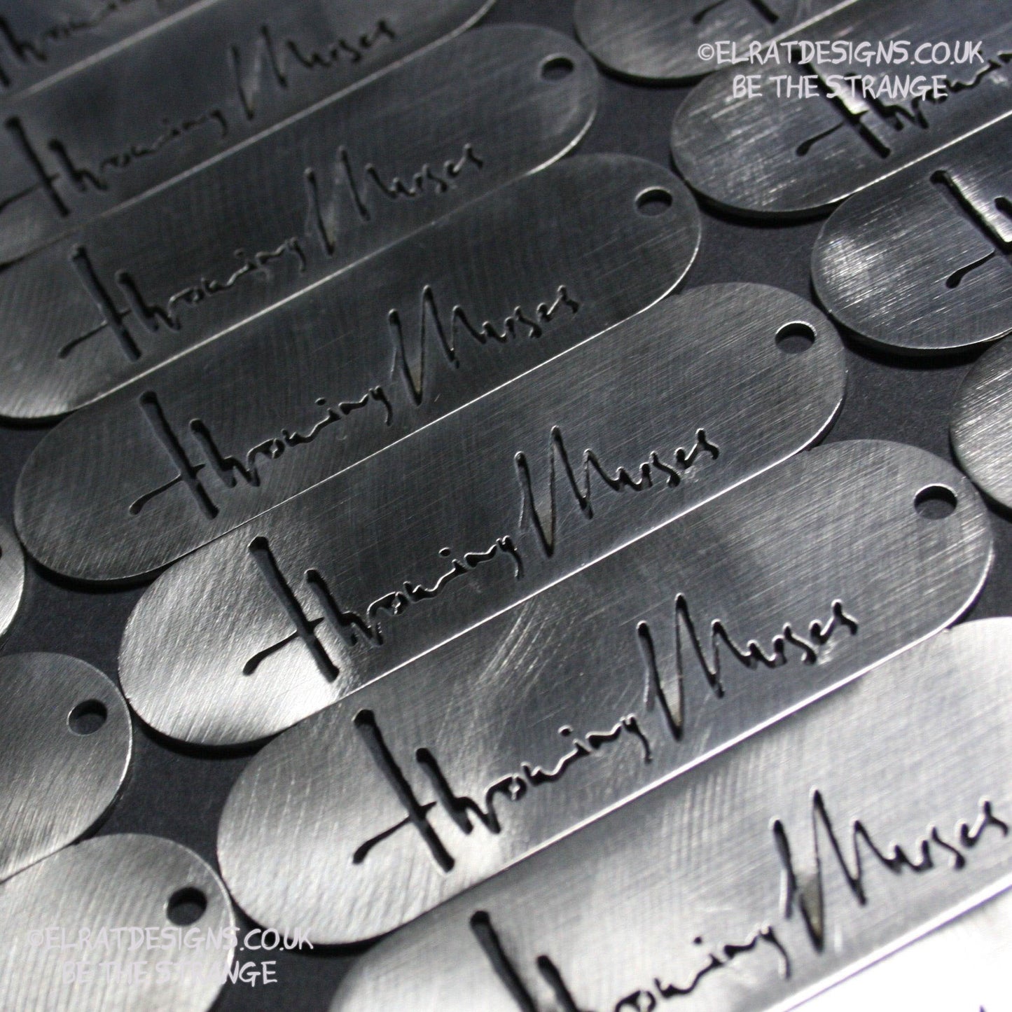 Throwing Muses 1986 logo CNC laser-cut stainless steel keyring, made in the UK from scrap for ElRat Designs - elratdesigns.co.uk