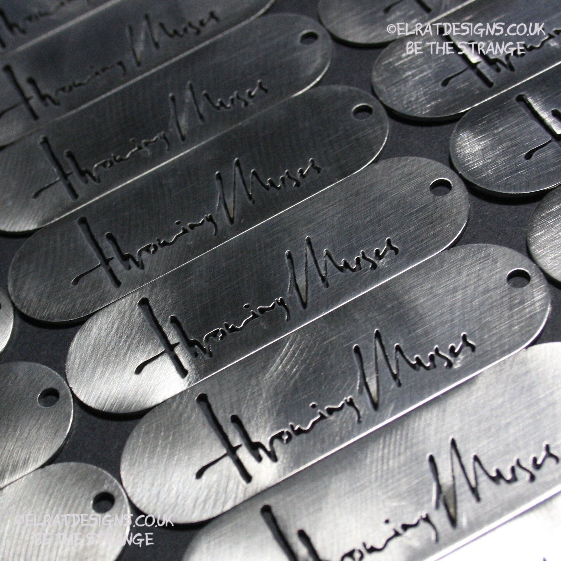 Throwing Muses 1986 logo CNC laser-cut stainless steel keyring, made in the UK from scrap for ElRat Designs - elratdesigns.co.uk
