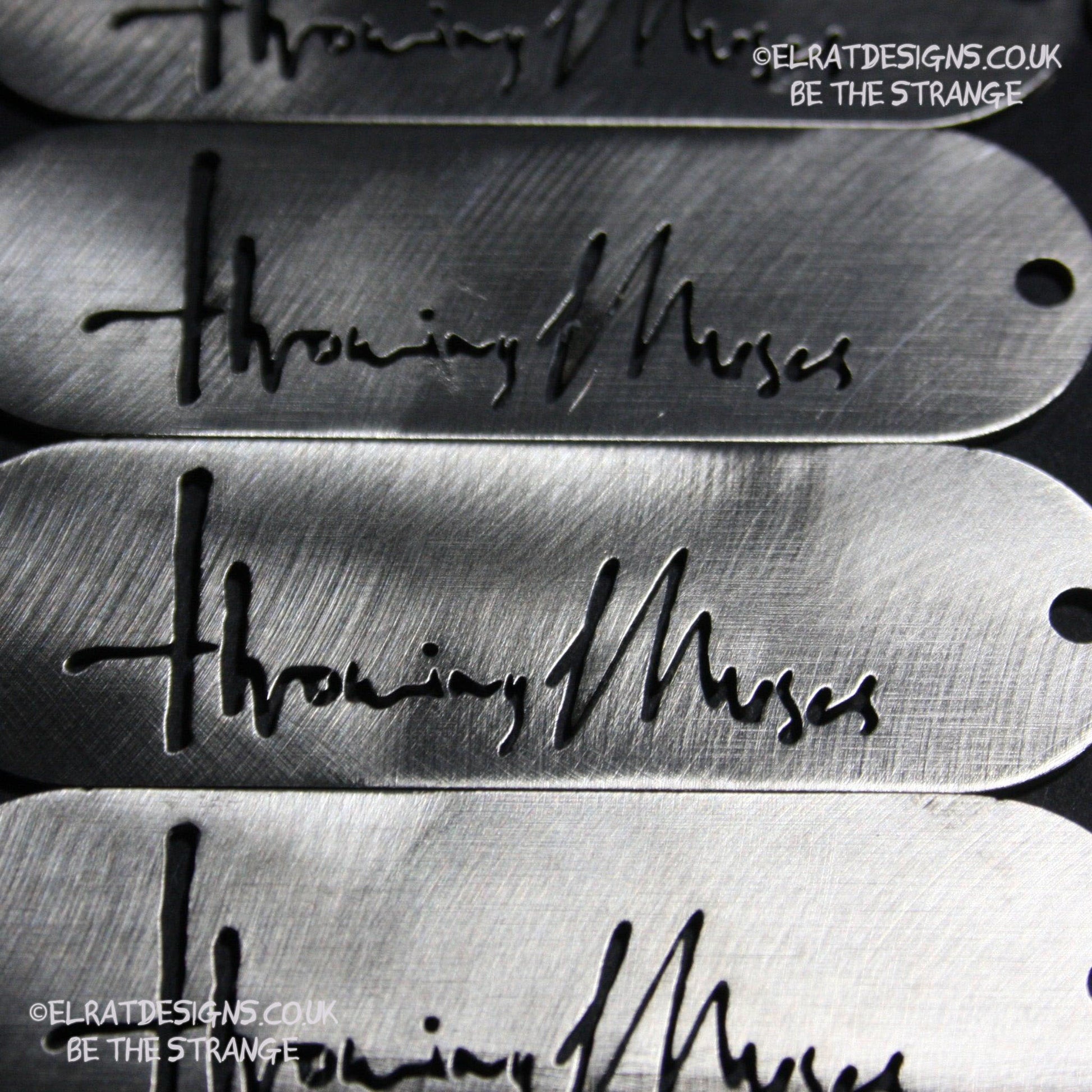 Throwing Muses 1986 logo CNC laser-cut stainless steel keyring, made in the UK from scrap for ElRat Designs - elratdesigns.co.uk