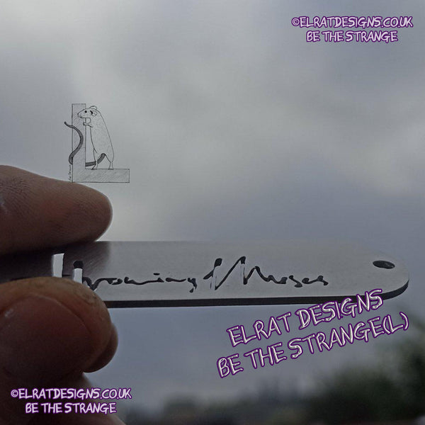 Throwing Muses 1986 logo CNC laser-cut stainless steel keyring, made in the UK from scrap for ElRat Designs - hero - elratdesigns.co.uk